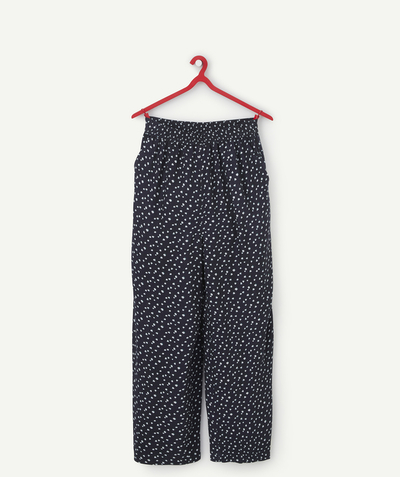 Trousers - Jeans Sub radius in - FLOWING TROUSERS FOR GIRLS IN ECO-FRIENDLY BLACK VISCOSE WITH A FLORAL PRINT
