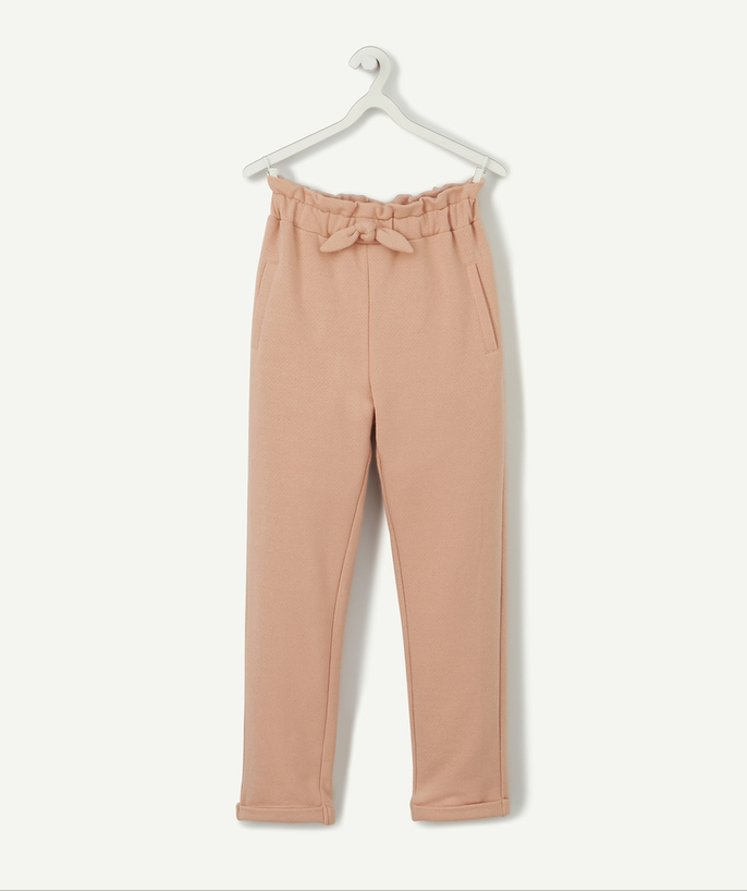 BOTTOMS radius - GIRLS' PEACH-COLOUR JOGGING PANTS WITH A BOW AND SPARKLING SPOTS