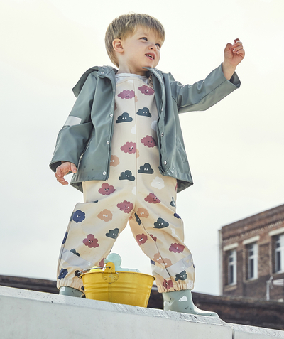 Rain cap Tao Categories - BEIGE AND PRINTED WATERPROOF DUNGAREES WITH CLOUDS FOR BABY BOYS AND GIRLS